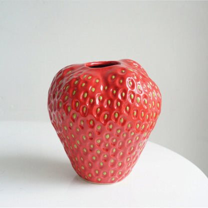 Decorative strawberry-shaped ceramic vase for flowers, featuring a unique and modern design, perfect for enhancing home decor. 9