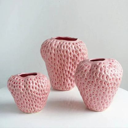 Decorative strawberry-shaped ceramic vase for flowers, featuring a unique and modern design, perfect for enhancing home decor. 4