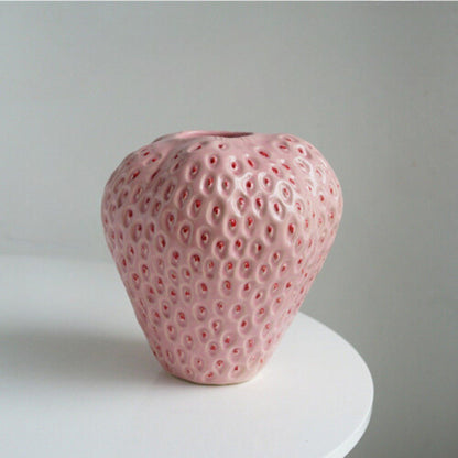 Decorative strawberry-shaped ceramic vase for flowers, featuring a unique and modern design, perfect for enhancing home decor. 8