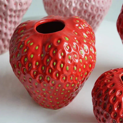 Decorative strawberry-shaped ceramic vase for flowers, featuring a unique and modern design, perfect for enhancing home decor. 2