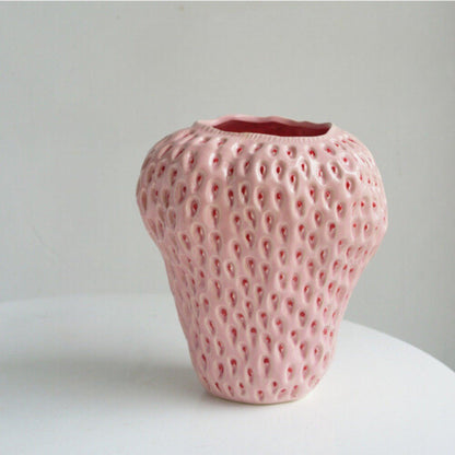 Decorative strawberry-shaped ceramic vase for flowers, featuring a unique and modern design, perfect for enhancing home decor. 12