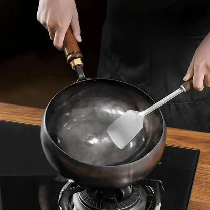 Deep Iron Wok Pan with Lid featuring a non-stick surface, ideal for induction cooking and versatile meal preparation, showcasing its sleek design and functionality. 2