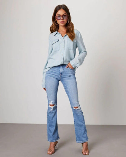Denim shirt for women featuring a button front, long sleeves, classic collar, and curved hemline. 7