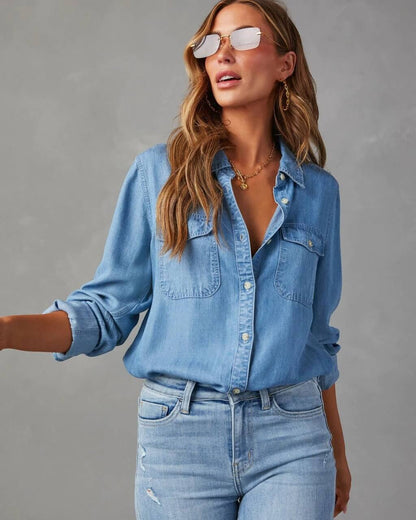 Denim shirt for women featuring a button front, long sleeves, classic collar, and curved hemline. 4