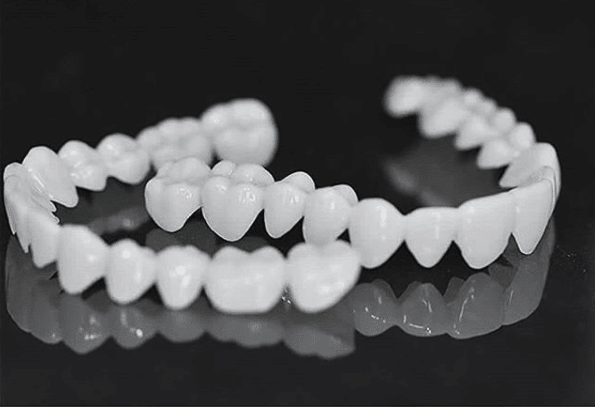 Dental veneers made from flexible, high-quality resin, designed for a natural appearance and comfortable wear, ideal for enhancing smiles. 6