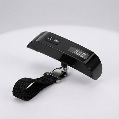 Digital luggage scale with backlit LCD display and ergonomic rubber handle, designed for portable travel with a maximum capacity of 50 kg. 0