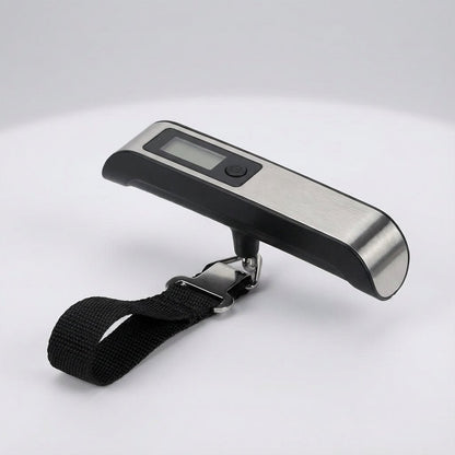 Digital luggage scale with backlit LCD display and ergonomic rubber handle, designed for portable travel with a maximum capacity of 50 kg. 4
