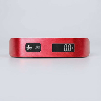 Digital luggage scale with backlit LCD display and ergonomic rubber handle, designed for portable travel with a maximum capacity of 50 kg. 2