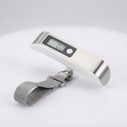 Digital luggage scale with backlit LCD display and ergonomic rubber handle, designed for portable travel with a maximum capacity of 50 kg. 10