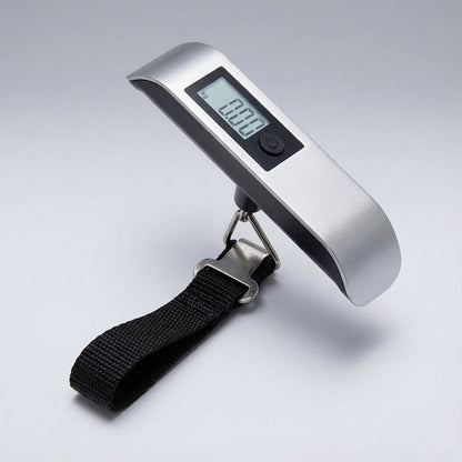 Digital luggage scale with backlit LCD display and ergonomic rubber handle, designed for portable travel with a maximum capacity of 50 kg. 9