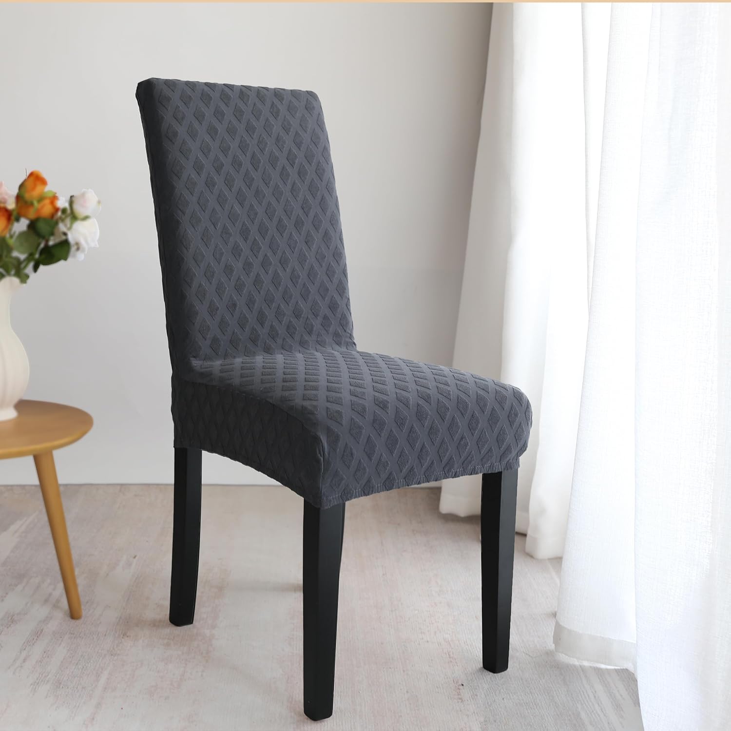 Set of stretchable and washable dining chair covers made from durable polyester fabric, designed to protect and enhance the look of dining room chairs, easy to install 3