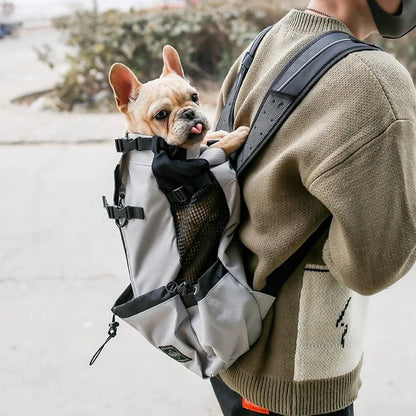 Dog travel bag made of breathable nylon with an ergonomic design, ideal for small to medium breeds, ensuring comfort for pets during travel. 1