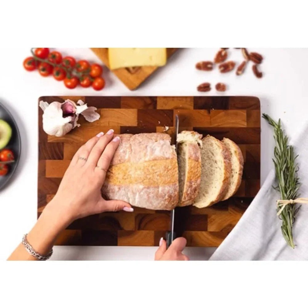 Double-sided wooden cutting board featuring drainage grooves, ideal for meal prep and versatile kitchen use. 2