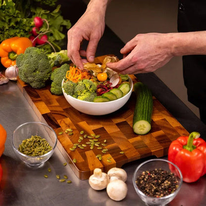 Double-sided wooden cutting board featuring drainage grooves, ideal for meal prep and versatile kitchen use. 4
