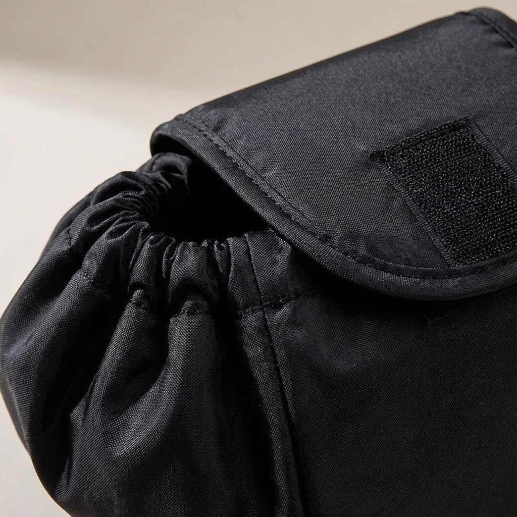 Drawstring Cosmetics Organizer in black featuring a spacious design and quick access compartments for easy storage and organization of beauty products. 2