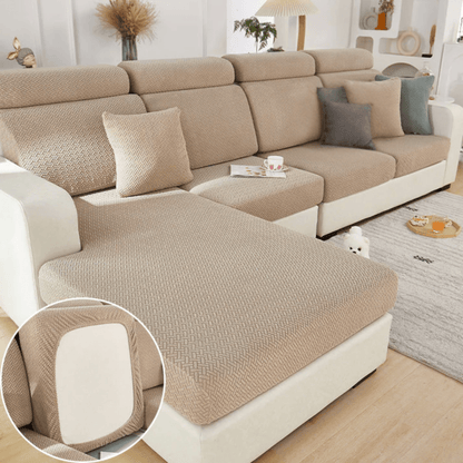 Elastic sofa cover designed for loose cushions, featuring stretch jacquard fabric for a snug fit, ideal for pet protection and easy machine washing. 1