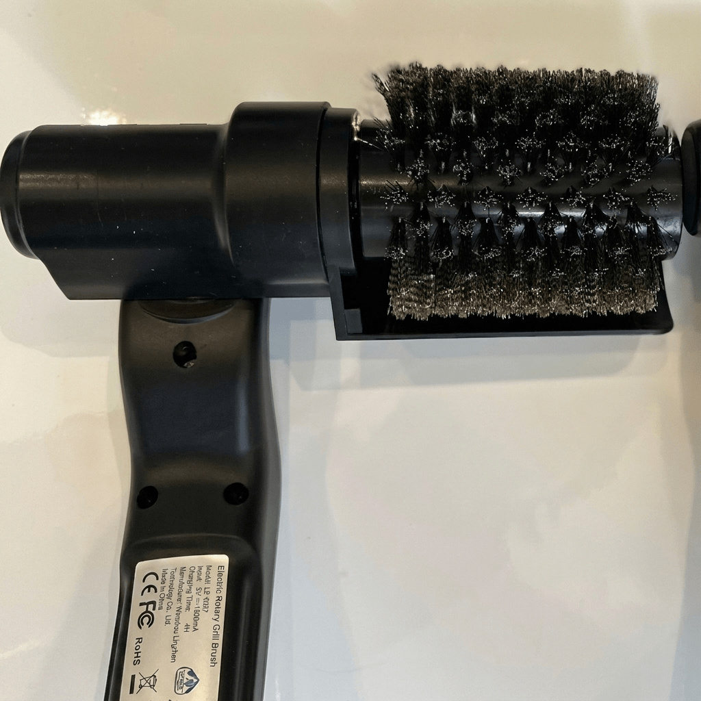 Electric BBQ Grill Brush designed for efficient grease removal, featuring a handheld powered cleaning tool ideal for barbecue grates. 6