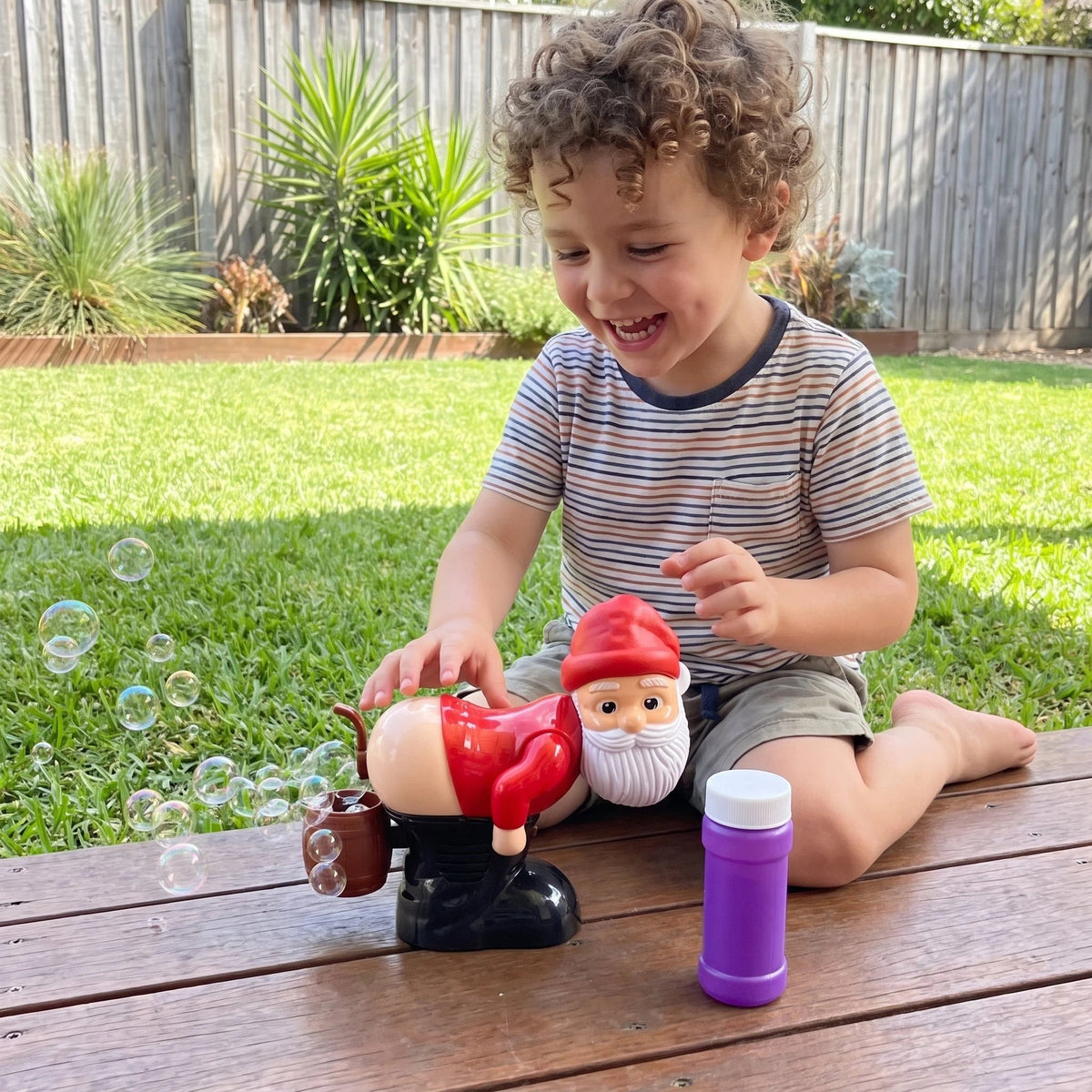 Electric Santa Bubble Blower featuring automatic bubble function, festive music, and colorful lights, perfect Christmas toy for kids to enjoy holiday fun. 7