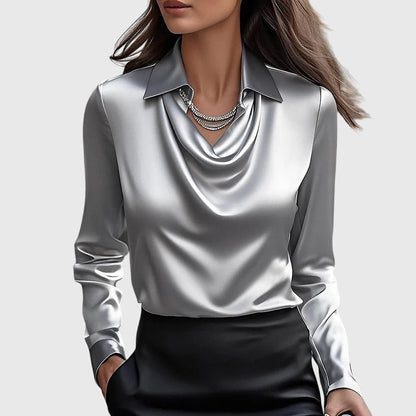 Elegant blouse featuring a pleated neckline and a flowing fit, perfect for versatile women's fashion. 1
