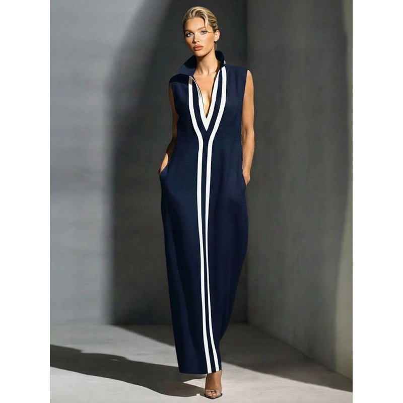 Elegant evening gown featuring a front zipper and side slit, designed in a navy and white contrast, perfect for formal events and wedding guests. 0