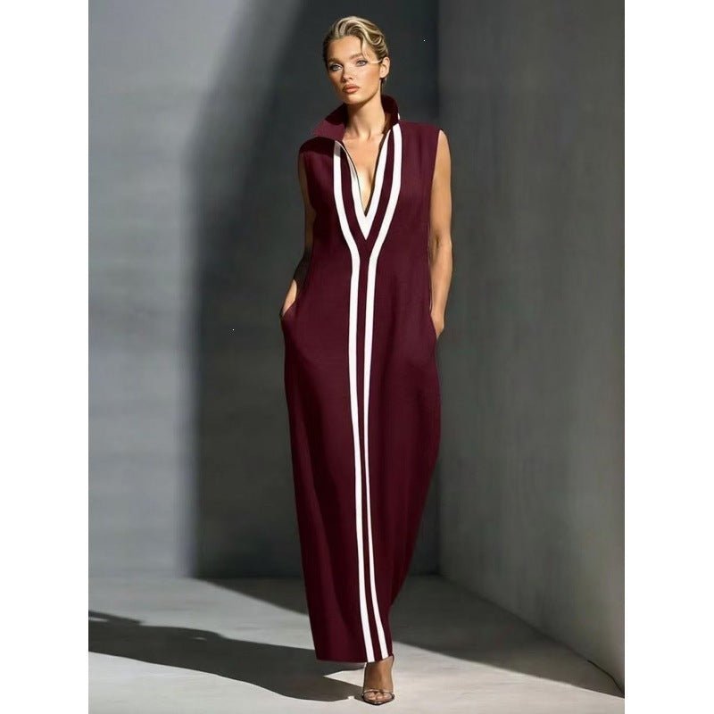 Elegant evening gown featuring a front zipper and side slit, designed in a navy and white contrast, perfect for formal events and wedding guests. 2
