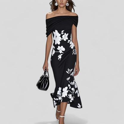 Elegant midi dress featuring a unique print and relaxed silhouette, made from soft and breathable fabric, perfect for any occasion. 2