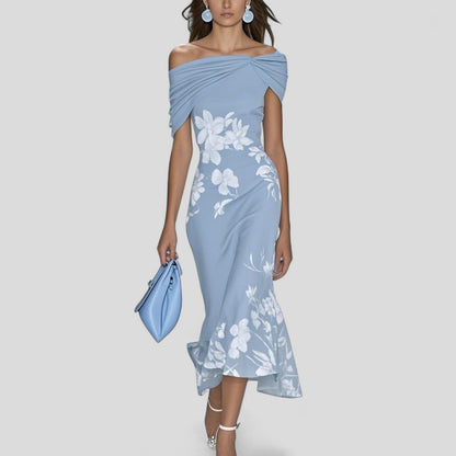 Elegant midi dress featuring a unique print and relaxed silhouette, crafted from soft breathable fabric for comfort and style. 1