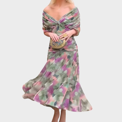Elegant off-shoulder evening dress featuring draped fabric and a ruched bodice, perfect for formal occasions and special events. 1