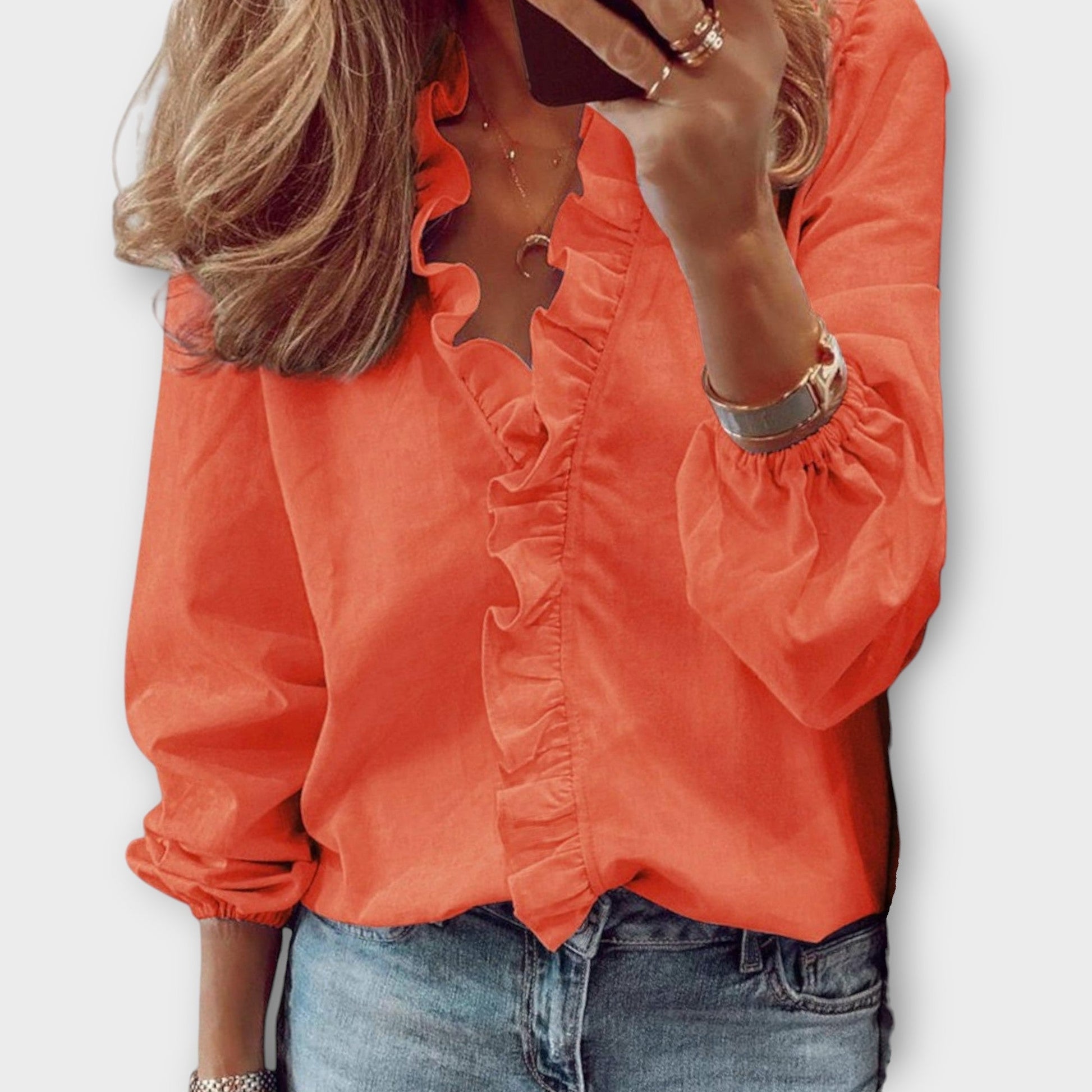 Elegant ruffled blouse in a tailored fit, showcasing timeless sophistication, available in multiple colors for versatile wear. 3