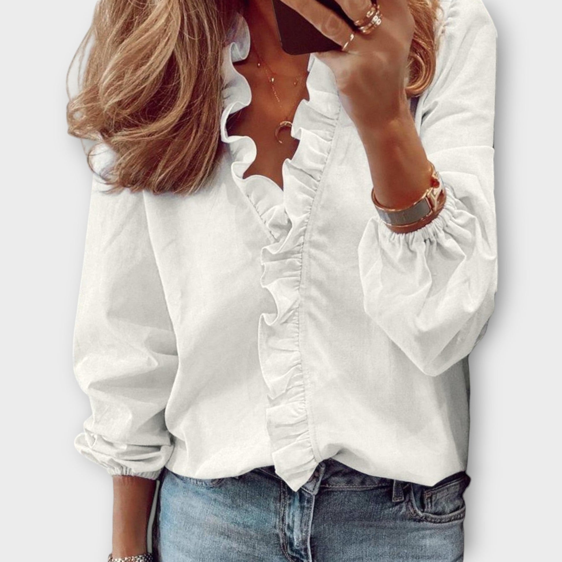 Elegant ruffled blouse in a tailored fit, showcasing timeless sophistication, available in multiple colors for versatile wear. 0