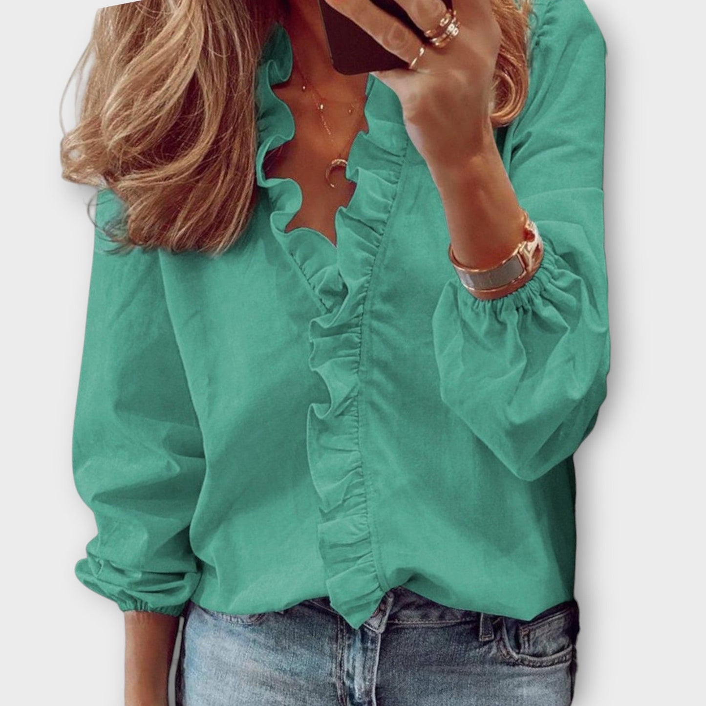 Elegant ruffled blouse in a tailored fit, showcasing timeless sophistication, available in multiple colors for versatile wear. 2