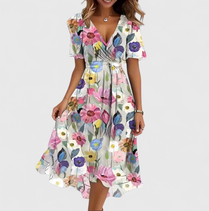 Elegant short dress featuring a vibrant floral design, delicate flutter sleeves, and a versatile high-low hemline perfect for any occasion. 5