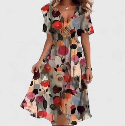 Elegant short dress featuring a vibrant floral design, delicate flutter sleeves, and a versatile high-low hemline perfect for any occasion. 4