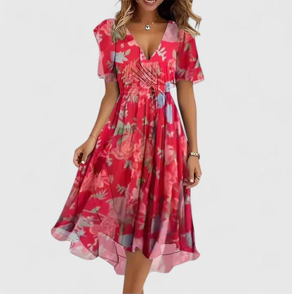 Elegant short dress featuring a vibrant floral design, delicate flutter sleeves, and a versatile high-low hemline perfect for any occasion. 0