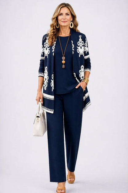 Elegant three-piece set featuring botanical print trousers, designed for plus size women, offering a lightweight and breathable casual outfit perfect for everyday wear. 7