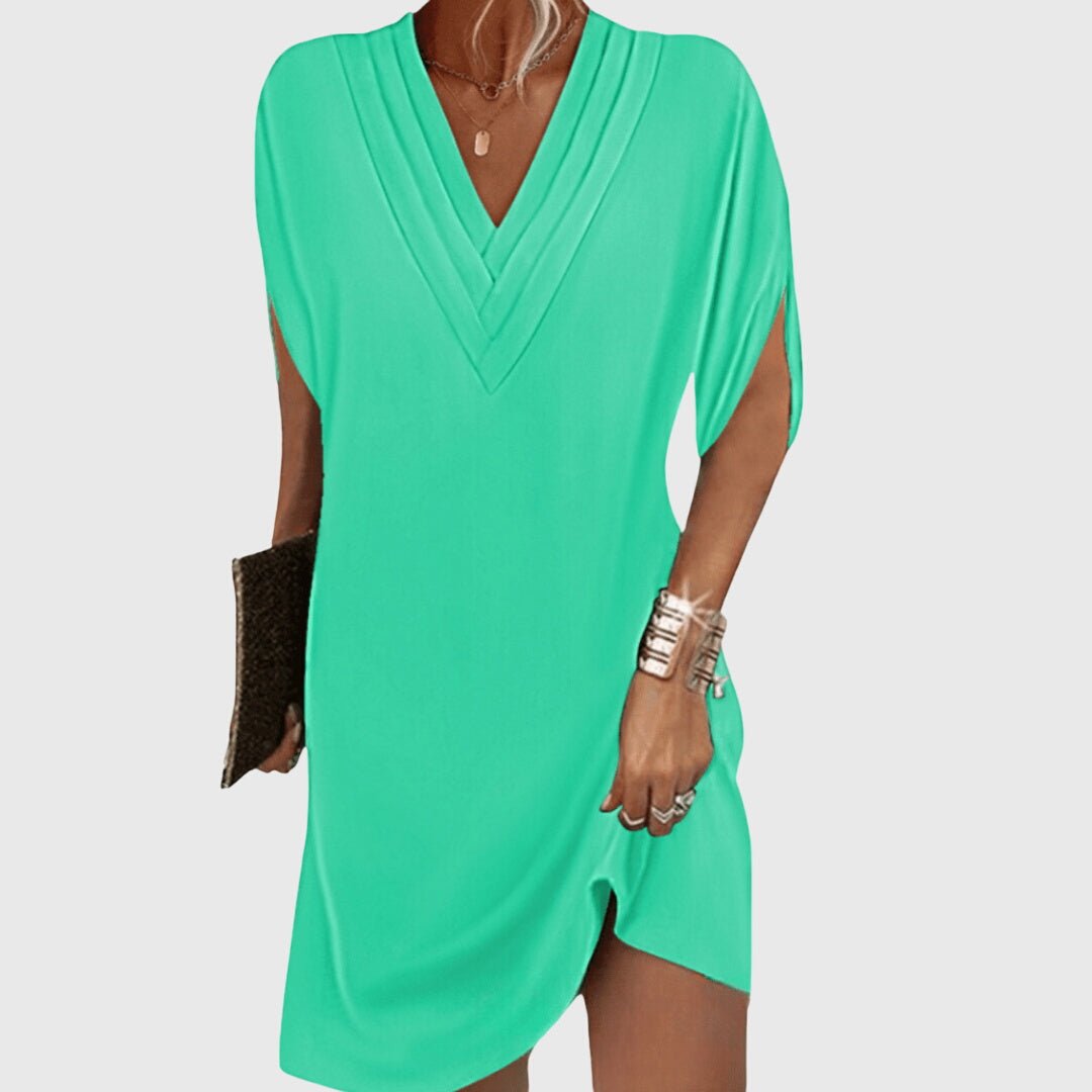 Elegant tummy-hiding dress featuring a flattering V-neckline, designed for versatile fit suitable for any occasion. 3