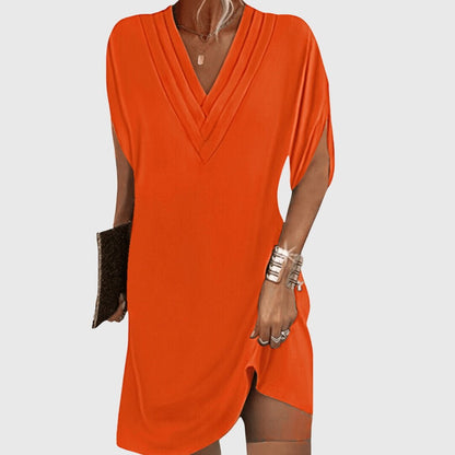 Elegant tummy-hiding dress featuring a flattering V-neckline, designed for versatile fit suitable for any occasion. 4