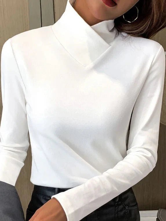 Elegant turtleneck sweater with a high collar made from soft, breathable fabric, perfect for cozy winter outfits. 0