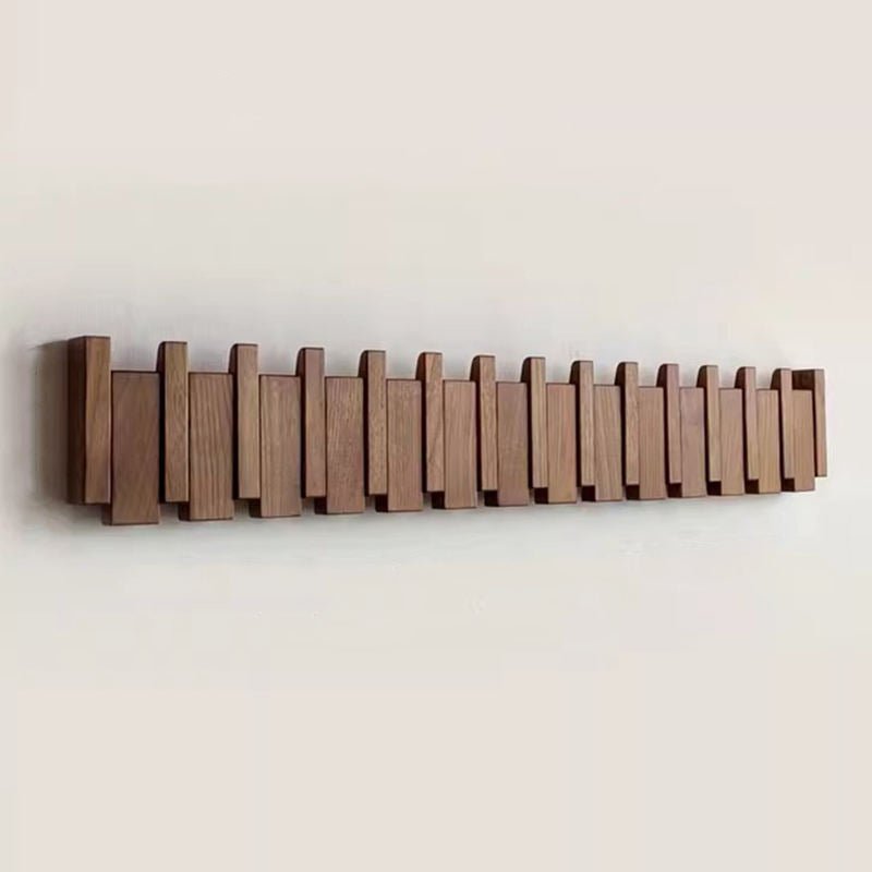 Elegant wooden hanger featuring foldable hooks and a piano-inspired design, perfect for stylish space organization and enhancing your closet aesthetics. 0