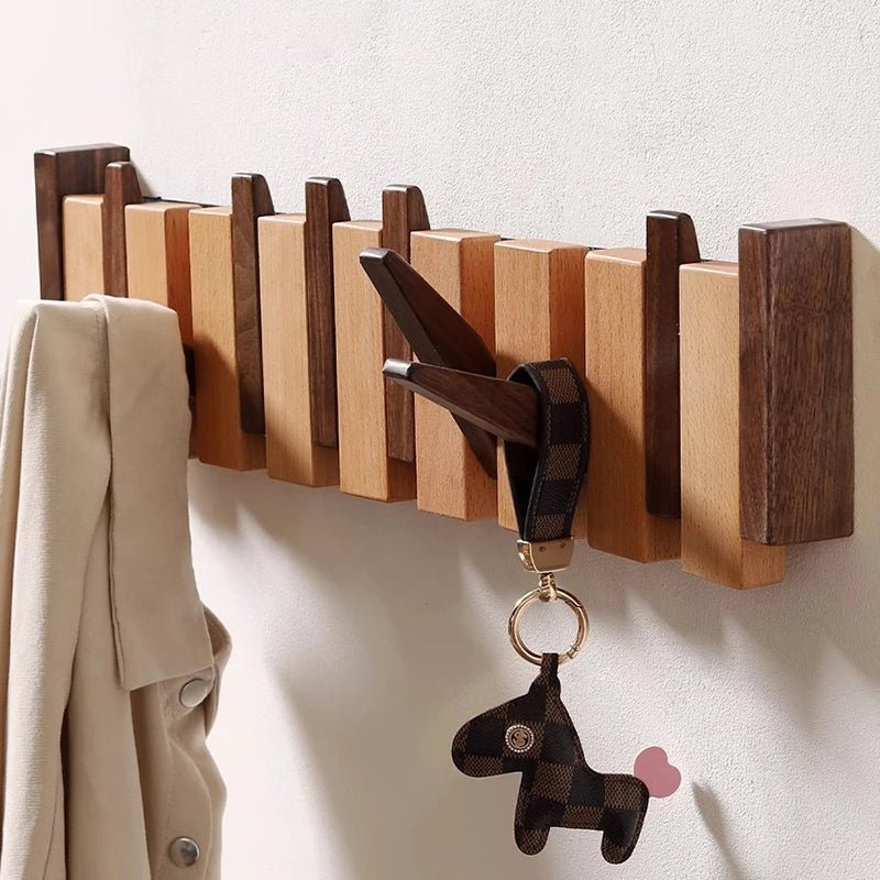 Elegant wooden hanger featuring foldable hooks and a piano-inspired design, perfect for stylish space organization and enhancing your closet aesthetics. 2
