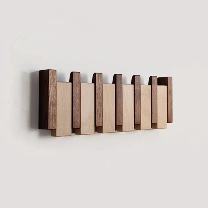 Elegant wooden hanger featuring foldable hooks and a piano-inspired design, perfect for stylish space organization and enhancing your closet aesthetics. 1
