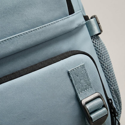 Ergonomic dark blue travel backpack featuring a waterproof exterior and a convenient integrated shoe compartment, perfect for travelers and outdoor enthusiasts. 3