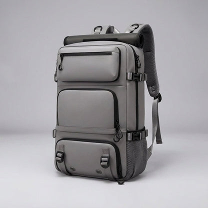 Ergonomic dark blue travel backpack featuring a waterproof exterior and a convenient integrated shoe compartment, perfect for travelers and outdoor enthusiasts. 4