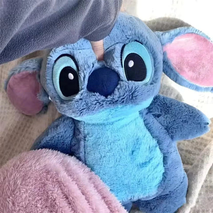 Extra large plush hot water bottle featuring a soft Stitch cover, perfect for cozying up during winter as a hand warmer. 0
