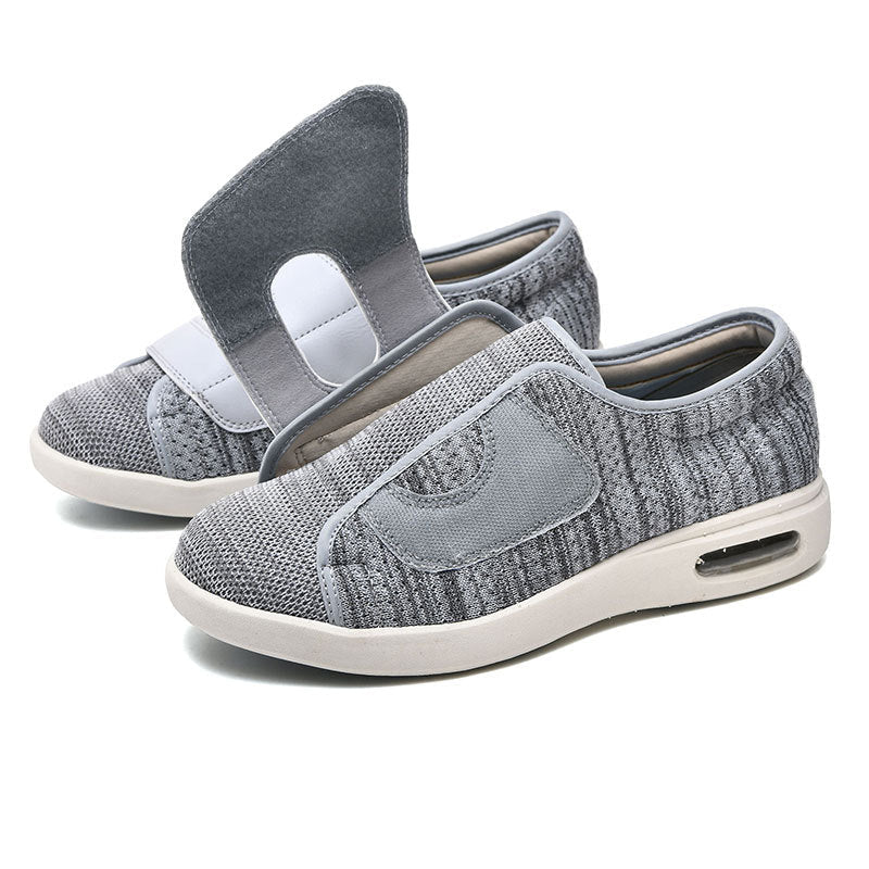 Extra wide diabetic walking shoes featuring adjustable Velcro straps and breathable mesh design, perfect for swollen feet and enhanced comfort. 1