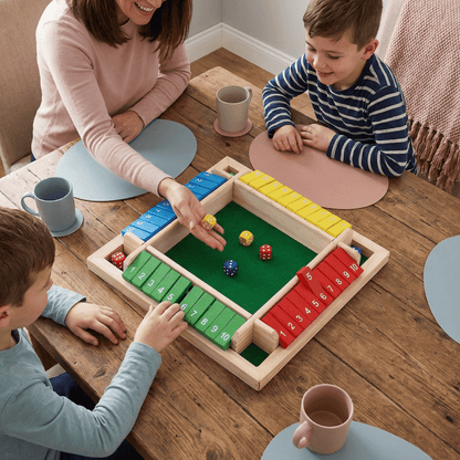 Family strategy board game featuring colorful wooden pieces and dice, designed for enjoyable tabletop play for all ages, promoting strategic thinking and family bonding. 1