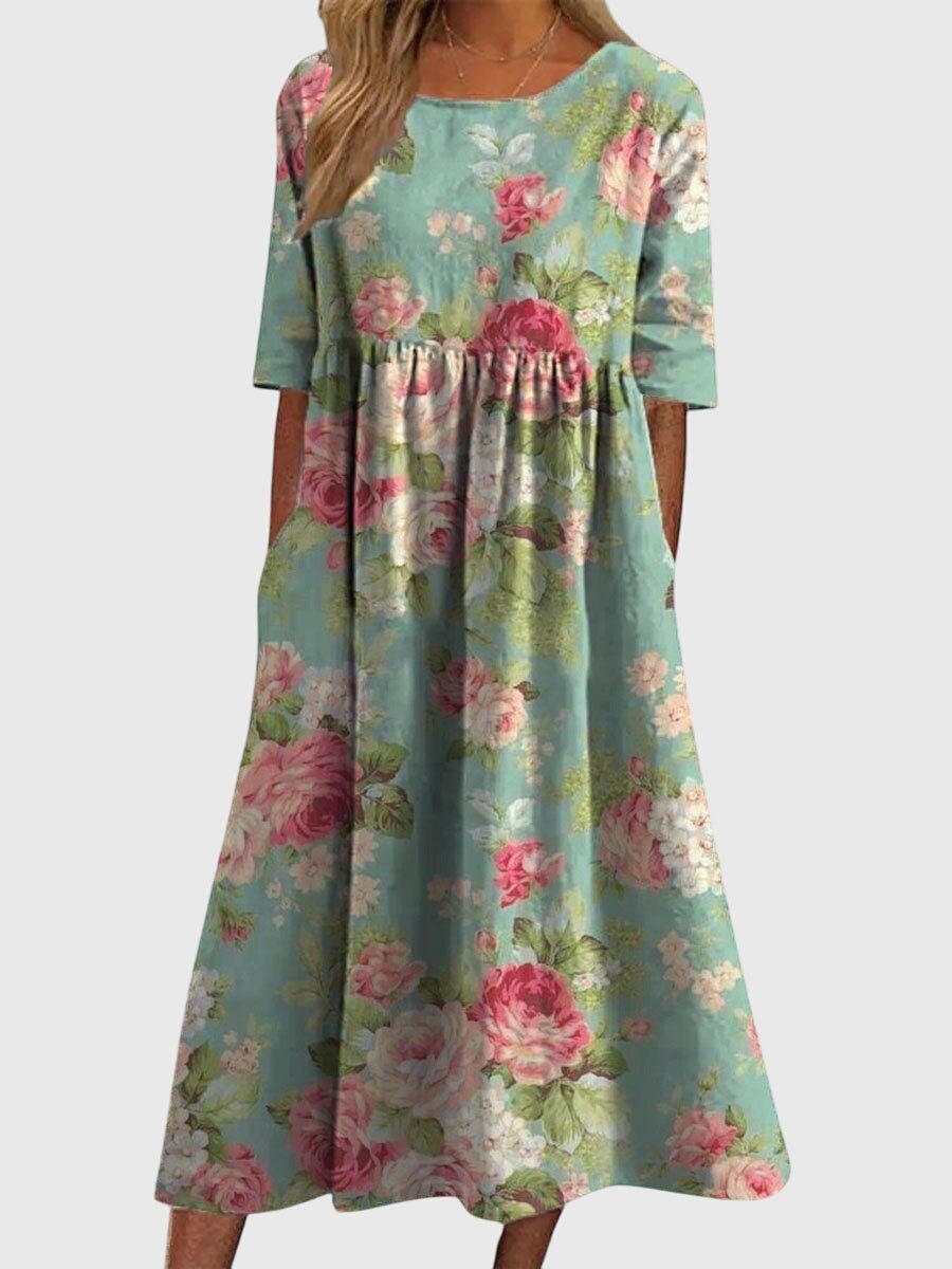Flattering midi dress for women featuring intricate embroidered details, perfect for versatile summer styling for any occasion. 1