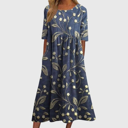 Flattering midi dress for women featuring intricate embroidered details, perfect for versatile summer styling for any occasion. 0