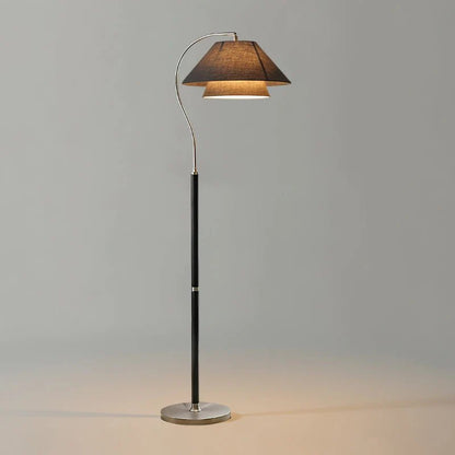 Modern Scandinavian floor lamp featuring layered fabric shades and an elegant arched frame, perfect for stylish home decor and ambient lighting. 11