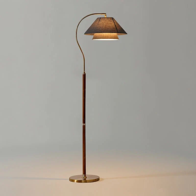 Modern Scandinavian floor lamp featuring layered fabric shades and an elegant arched frame, perfect for stylish home decor and ambient lighting. 10
